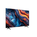 Slim flat-screen TV on two black stands displaying a vivid abstract wallpaper with swirling blue, orange, and red patterns